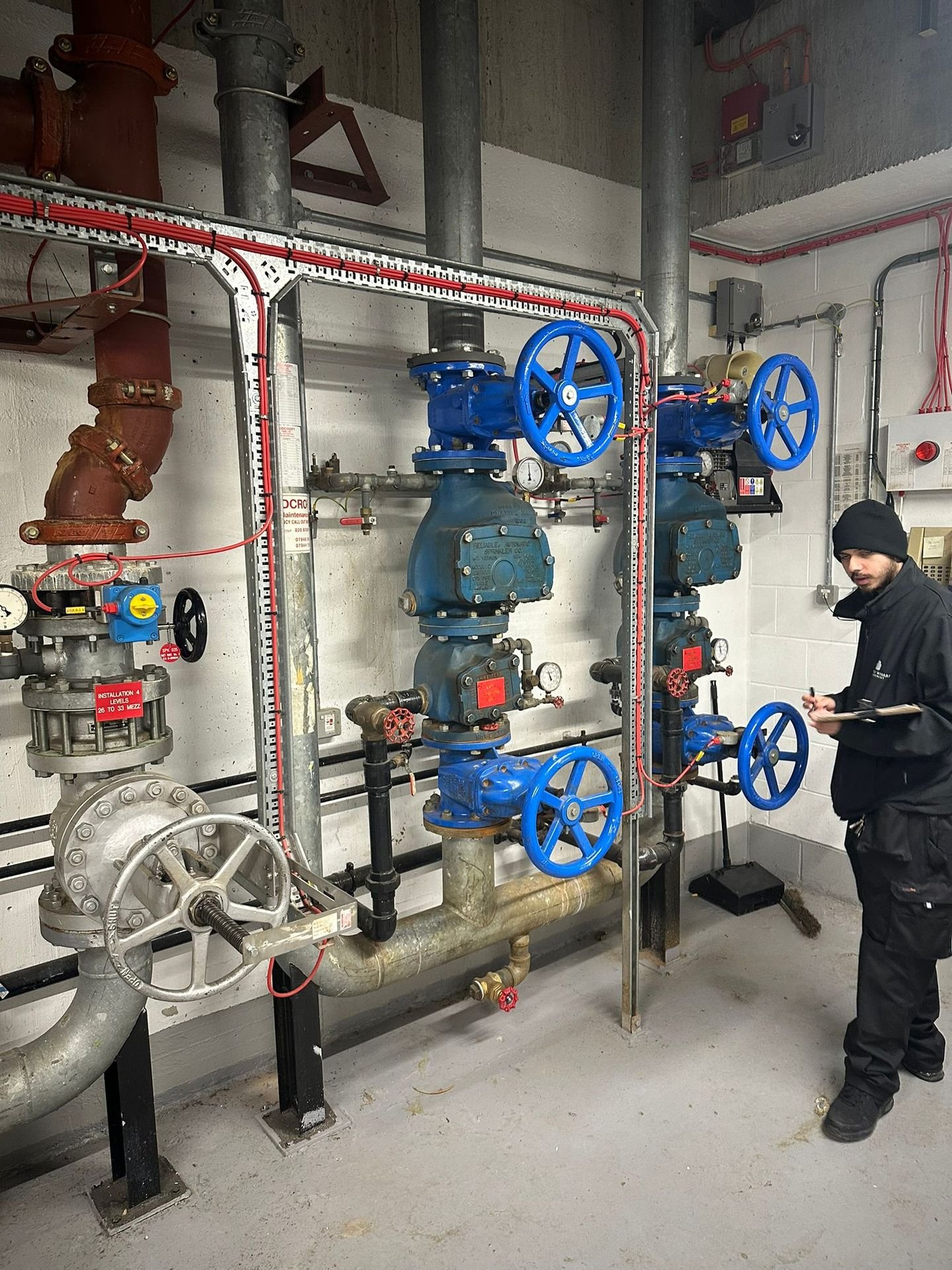 Engineer inspecting pipework systems