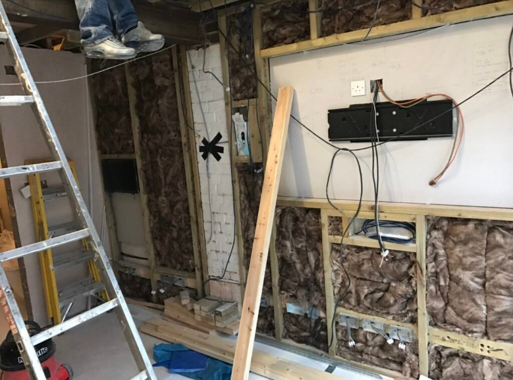 Media wall being studded and boarded