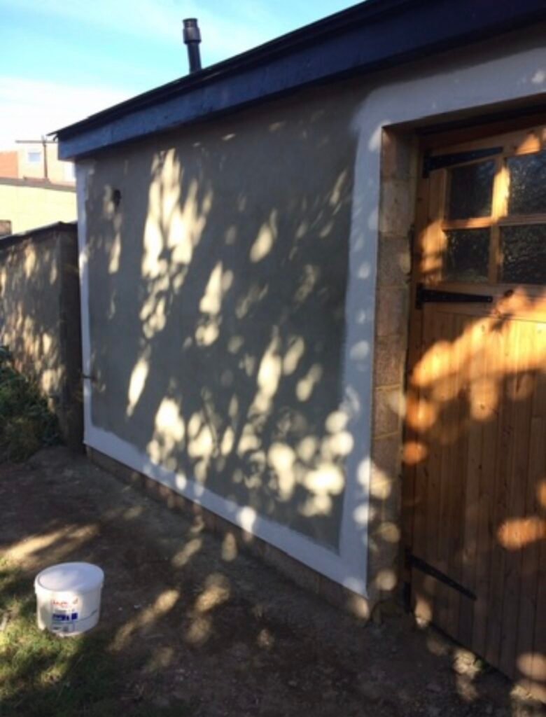 Rendered wall being painted
