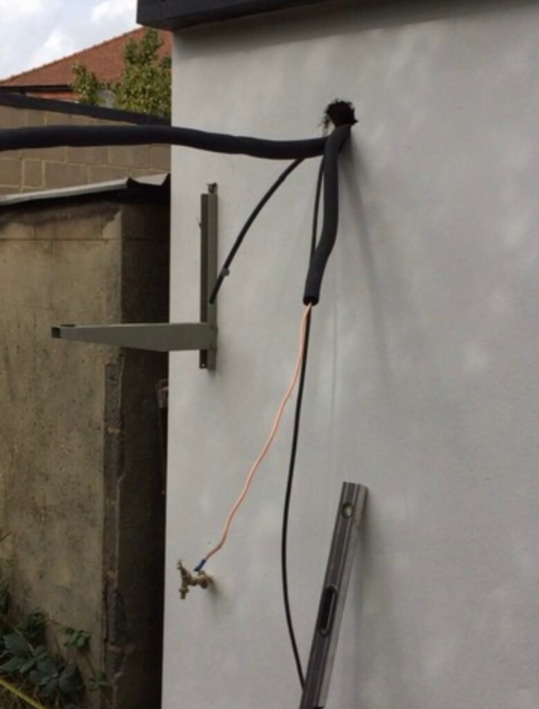 Out door air-conditioning condenser being installed