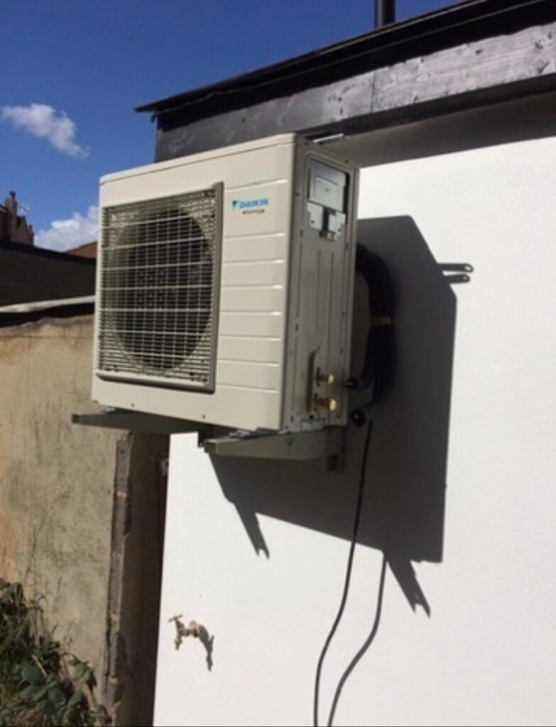 Airconditioning Condenser unit being mounted