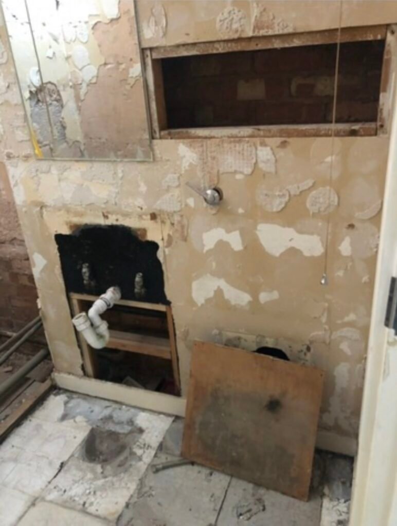 Removal of old toilet, sink and wall tiles